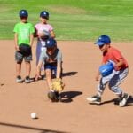kids practicing how to catch a ball