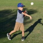 boy throwing a ball during practice