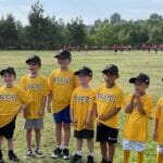 group of kids with yellow shirts